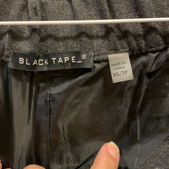 New dress pants. Size xs. Waist has some stretch. Dark with faint pinstrip. - Picture 4 of 4